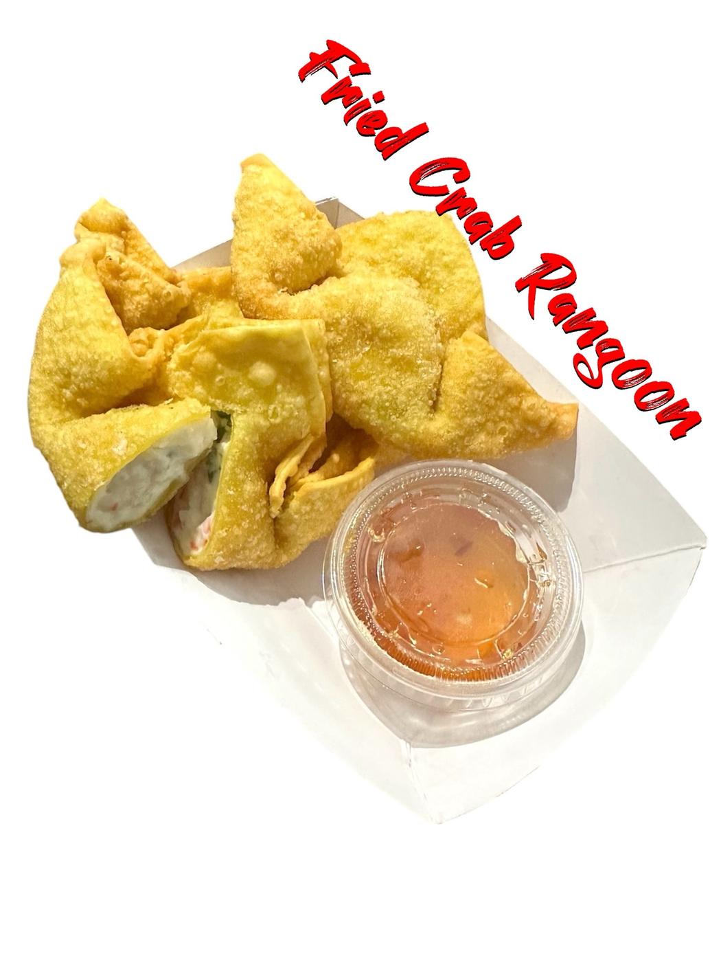 Fried crab Rangoon with a cup of dipping sauce