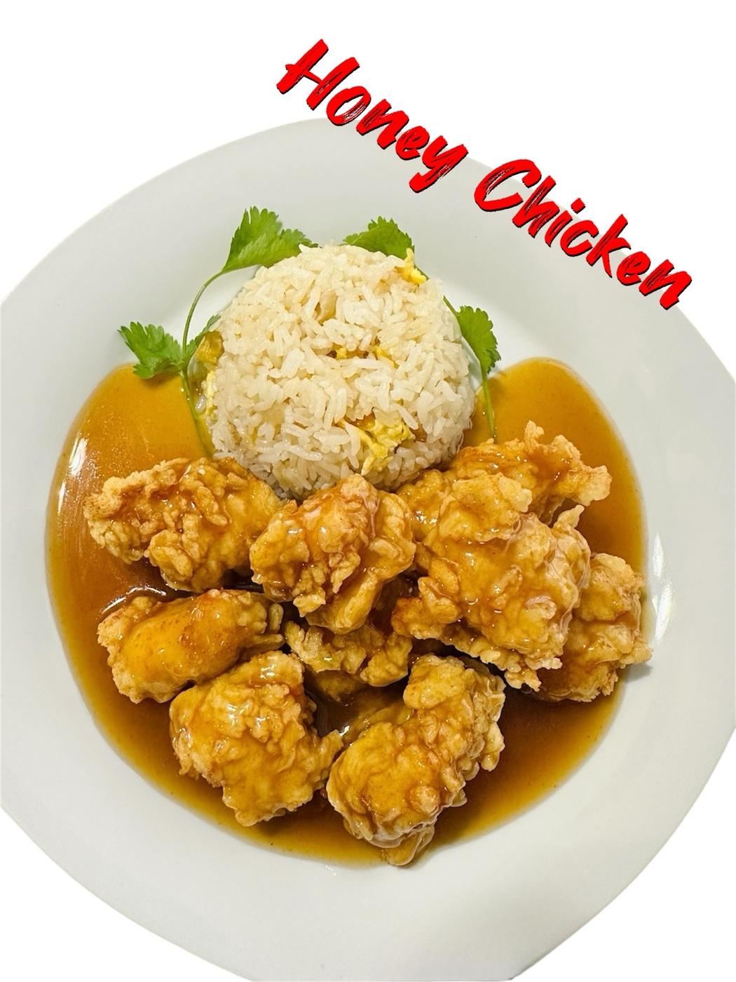 Honey chicken with fried rice on a white plate